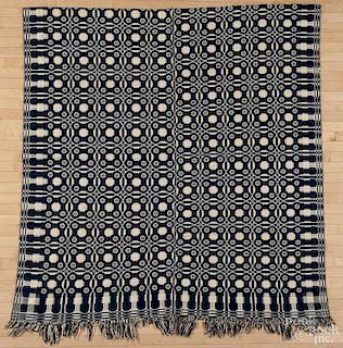 Two blue and white overshot coverlets, mid 19th c., with a pine tree border, 96'' x 76'' and 74'' x 80''