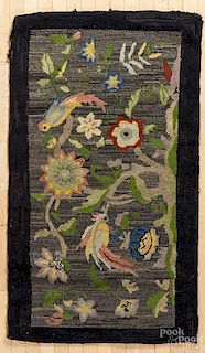 Hooked rug, early 20th c., with parrots perched on floral branches, 59'' x 33 1/2''.