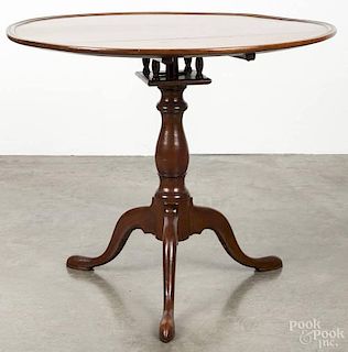 Pennsylvania Chippendale walnut tea table, ca. 1780, with a dish top over a birdcage support, 28 1/2