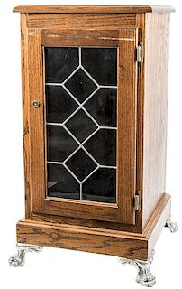 Oak Slot / Vending Machine Stand with Paneled Glass Door and Fancy Nickel Plated Brass Legs.