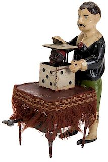 Antique Wind-Up Magician Toy.