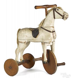 Carved and painted horse tricycle
