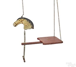 Carved and painted pine horse head child's swing