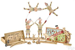 Two wooden circus clowns and juggling toys