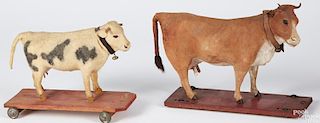 Two cow on platform pull toys