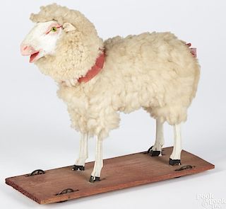 Stick leg sheep on platform pull toy