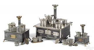 Three German tin toy stoves