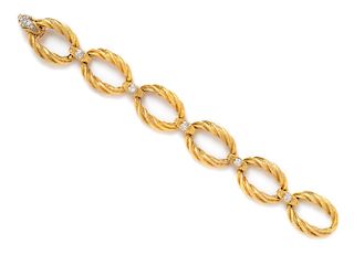 An 18 Karat Yellow Gold, Platinum and Diamond Link Bracelet, French, 40.20 dwts.