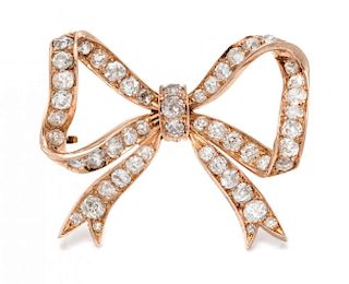 A Victorian Rose Gold and Diamond Bow Pendant, 8.10 dwts.