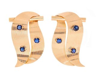 A Pair of Retro Yellow Gold and Sapphire Dress Clip Brooches, 13.60 dwts.