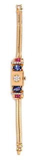 A Retro Yellow Gold, Sapphire, Ruby and Diamond Surprise Wristwatch, 25.10 dwts.