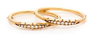 A Pair of Yellow Gold and Diamond Bangle Bracelets, 21.00 dwts.