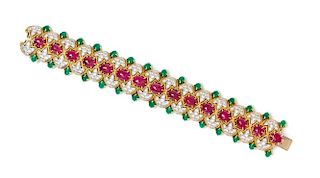 An 18 Karat Yellow Gold, Platinum, Ruby, Diamond and Emerald Bracelet, Circa 1960, 83.00 dwts.