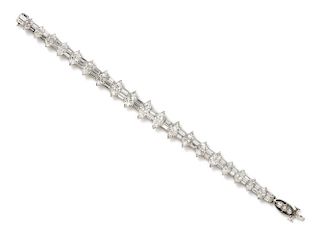 A Platinum, White Gold and Diamond Line Bracelet, 21.90 dwts.