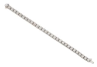 * A White Gold and Diamond Line Bracelet, 15.90 dwts.