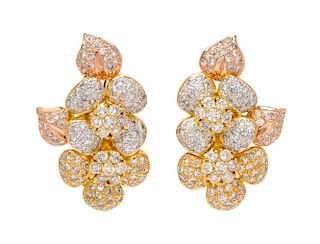 A Pair of 18 Karat Bicolor Gold and Diamond Earclips, 18.50 dwts.