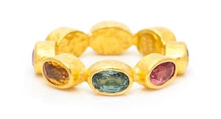 A 23 Karat Yellow Gold and Fancy Sapphire Eternity Band, 3.85 dwts.