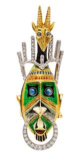An 18 Karat Bicolor Gold, Platinum, Polychrome Enamel and Diamond Tribal Mask Brooch, 15.30 dwts.