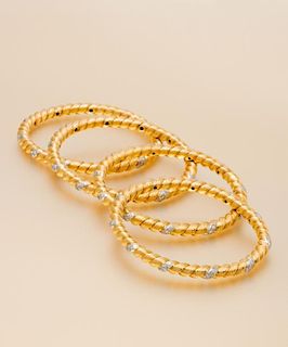 A Collection of 18 Karat Yellow Gold, Platinum and Diamond Bangle Bracelets, Van Cleef & Arpels, France, 81.90 dwts.