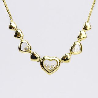 Vintage Chopard Happy Diamond and 18 Karat Yellow Gold Multi Hearts Charm Necklace.