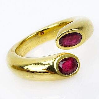 Vintage Cartier Approx. 1.20 Carat Oval Cut Ruby and 18 Karat Yellow Gold Ellipse Deux Tetes Croisees Bypass Ring.