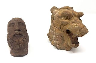 A Pair of Terracotta Figurines. A Lion Head and a Man Face