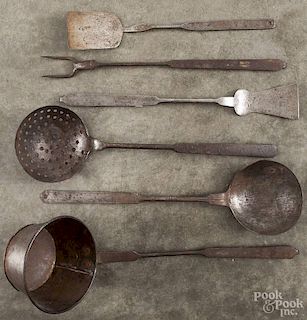 Six wrought iron utensils, 19th c., with punch decorated handles, longest - 19'' l.