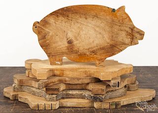 Six wooden cut out pig cutting boards, 19th/20th c., largest - 19'' l.