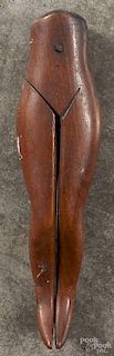 Carved walnut nutcracker, ca. 1900, in the form of legs, 7'' l.