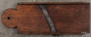 Pennsylvania cherry slaw board, 19th c., with a lollipop end, 24'' h.