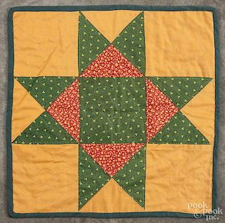 Pennsylvania patchwork star variant doll quilt, 20th c., 15'' square.
