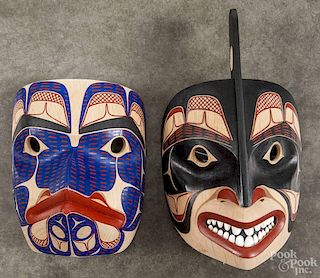 Two Tlingit painted masks, by David Boxley, 13'' h. and 9'' h.