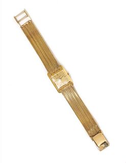 A Yellow Gold Wristwatch, Baume & Mercier, 27.60 dwts.