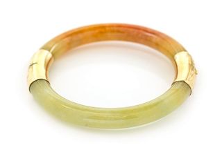 A Yellow Gold and Jade Bangle Bracelet, 34.00 dwts.