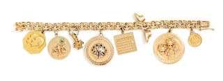 A 14 Karat Yellow Gold Bracelet with Eight Attached Charms, 48.80 dwts.