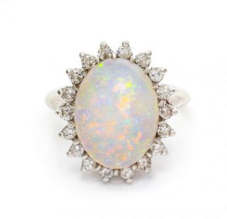 A 14 Karat White Gold, Opal and Diamond Ring, 4.50 dwts.