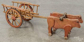 Painted wood oxen cart pull toy, ca. 1900, overall length - 31''.