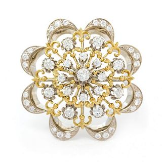 A Bicolor Gold and Diamond Cluster Brooch, 9.90 dwts.