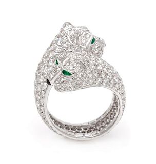 An 18 Karat White Gold, Diamond, Emerald and Onyx Panther Motif Ring, 7.00 dwts.