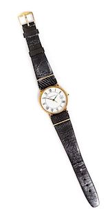 A 14 Karat Yellow Gold Wristwatch, Tiffany & Co., 16.00 dwts.