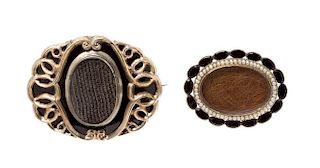 A Collection of Victorian Onyx, Seed Pearl, and Hair Mourning Brooches, 26.90 dwts.