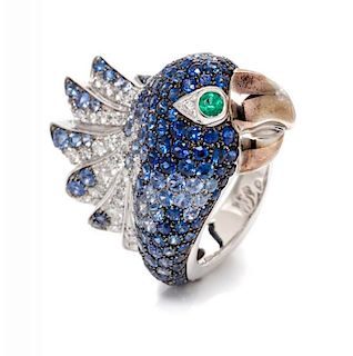 An 18 Karat White Gold, Sapphire, Diamond and Emerald Bird Motif Ring, 12.50 dwts.
