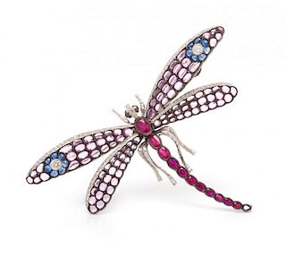 An 18 Karat White Gold, Ruby, Sapphire and Diamond Dragonfly Brooch, 17.20 dwts.