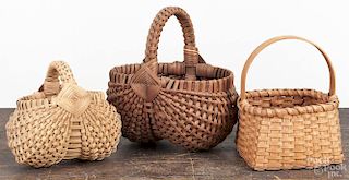 Three contemporary splint baskets, two signed Muehling Lititz Pa, 7'' h., 9'' h., and 8'' h.