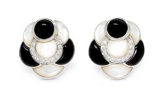 A Pair of 18 Karat White Gold, Diamond, Onyx and Mother-of-Pearl Earclips, 10.40 dwts.