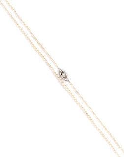 A Graduated Single Strand Pearl Necklace with 14 Karat White Gold and Diamond Clasp, 1.60 dwts.