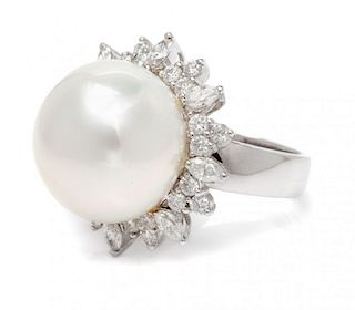An 18 Karat White Gold, Diamond and Cultured Pearl Ring, 10.30 dwts.