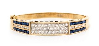 A 14 Karat Yellow Gold, Diamond and Sapphire Bangle Bracelet, 20.80 dwts.
