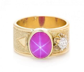 A 14 Karat Yellow Gold, Synthetic Star Ruby and Diamond Ring, 6.40 dwts.