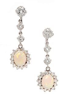 A Pair of White Gold, Opal and Diamond Pendant Earrings, 4.10 dwts.